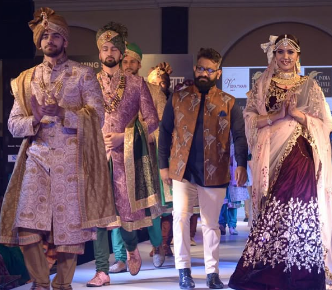 Avinash Mishra walking the ramp in a fashion show 