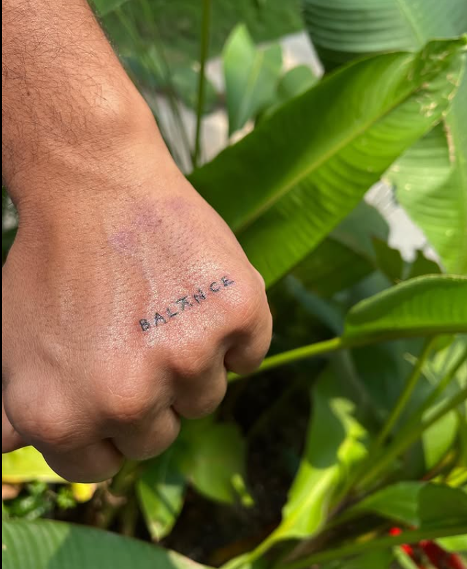 Sam Merchant's Balance Tattoo - On his left hand