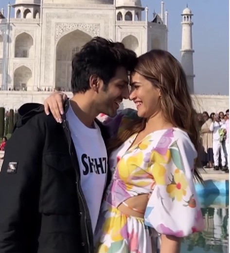 Kartik Aaryan with Kriti Sanon in a scene of the film 'Shehzada'