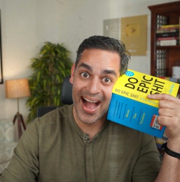 Ankur Warikoo holding the book 'Do Epic Shit'
