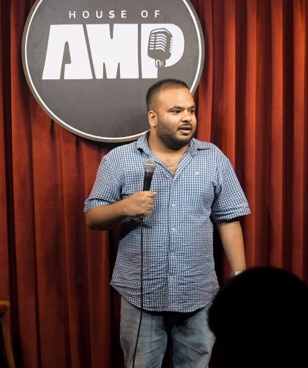 Pulikit Mani performing stand-up comedy
